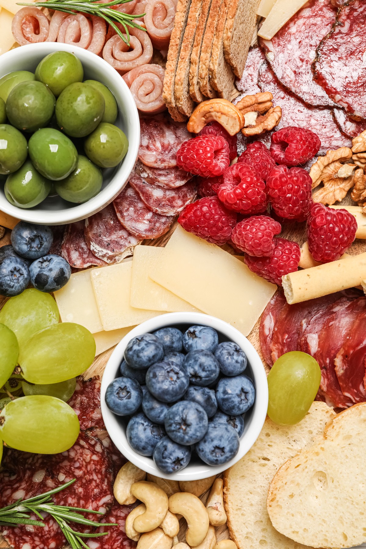Cheese, fruit and cured meats arranged for grazing.